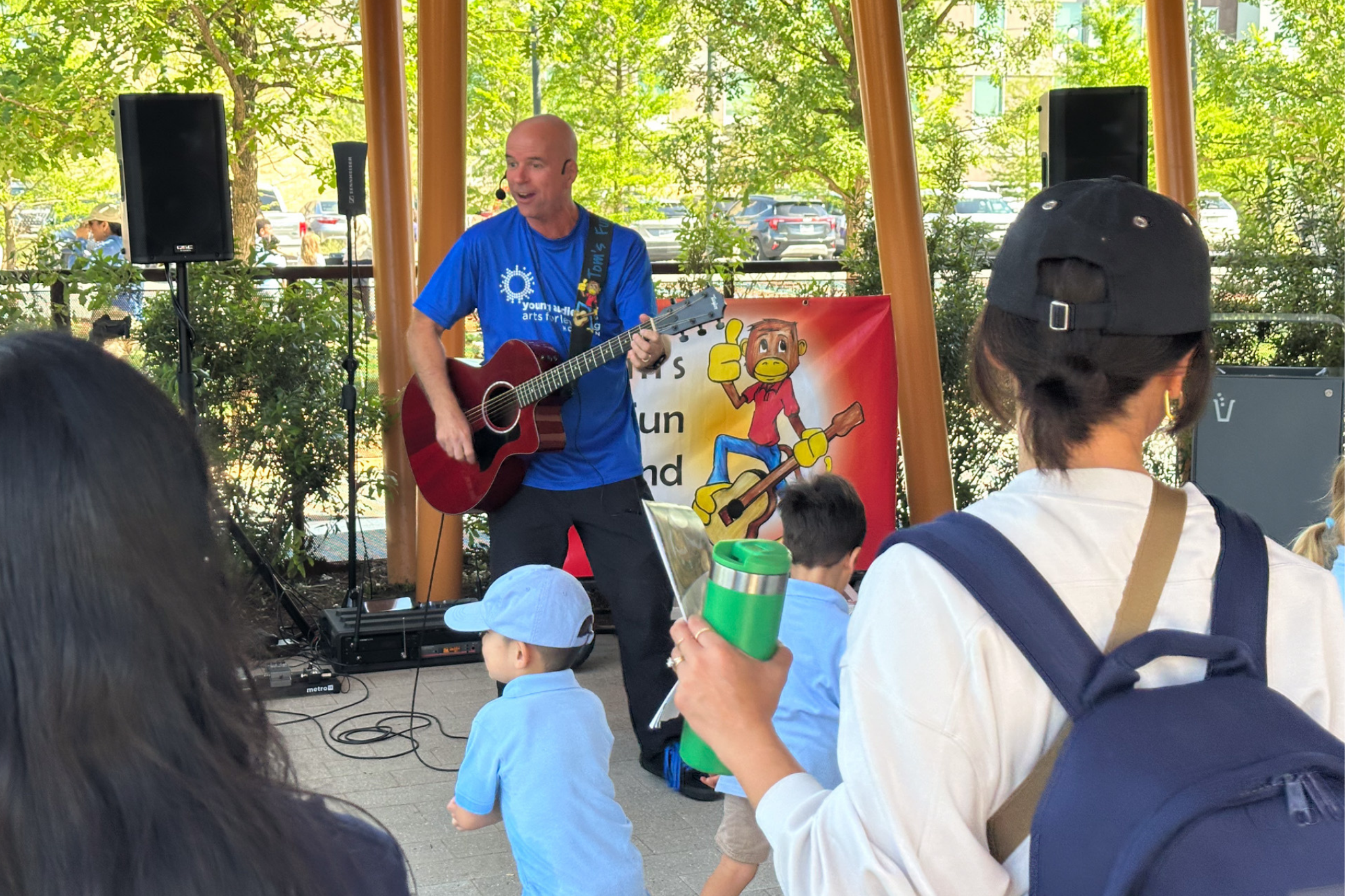 Man playing guitar for young kids
